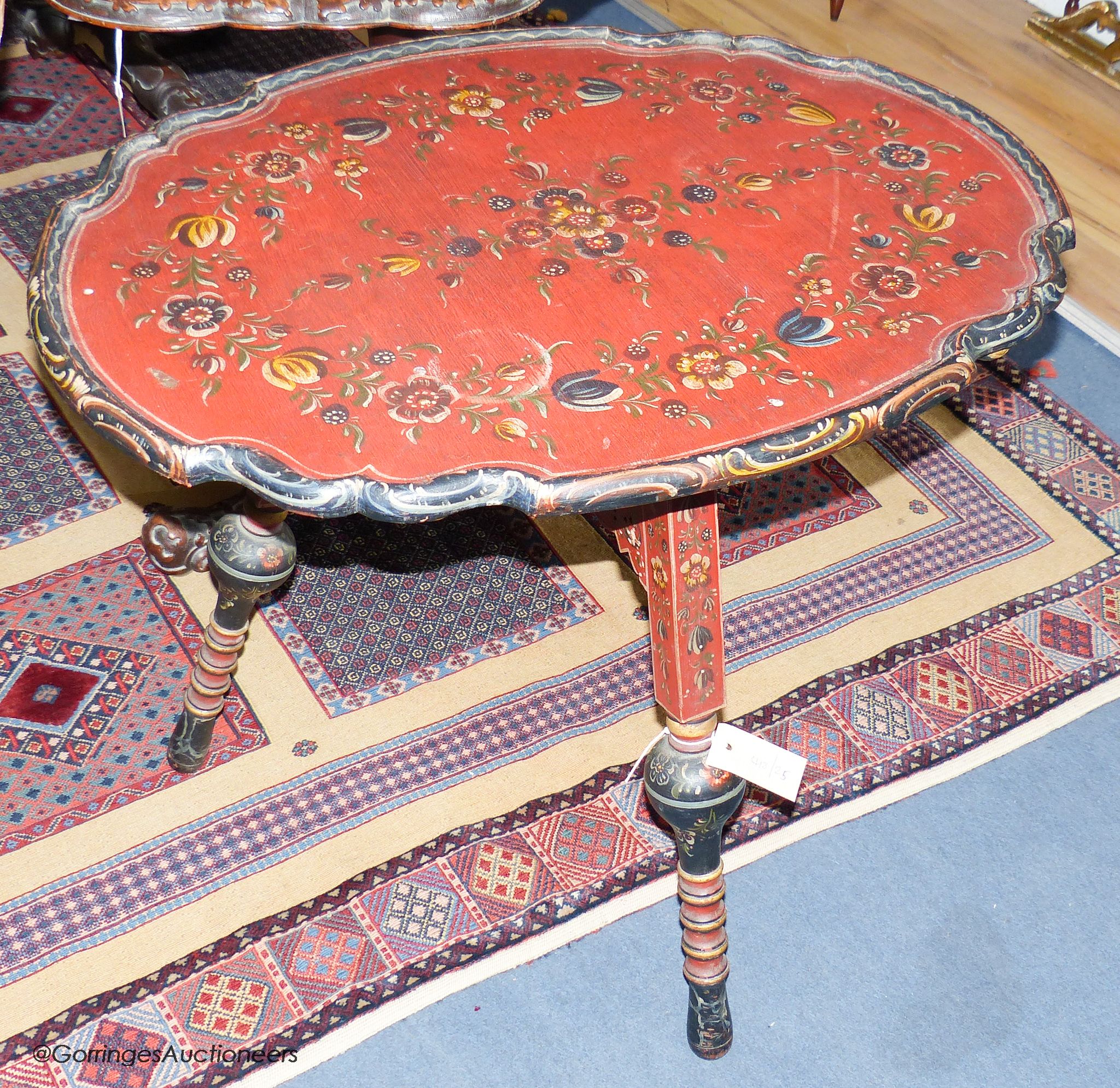 A 19th century Swiss painted folding table, 75 cm long, 56 cm deep, 62 cm pine, the underside with carved heads and painted religious scene